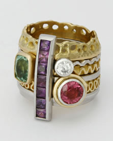 'Stacking Ring' in 18K yellow and white gold with bridge feature set with seven princess cut mauve Sapphires